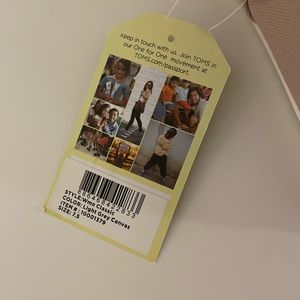 Brand new never worn Toms size 7.5